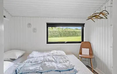 a bedroom with a bed and a window at 3 Bedroom Cozy Home In Vinderup in Vinderup
