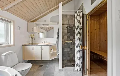 a bathroom with a toilet and a sink at 3 Bedroom Cozy Home In Højslev in Højslev