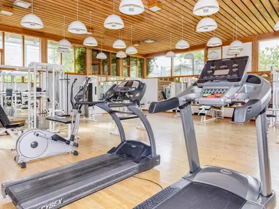 a gym with several treadmills and a treadmill at 12 person holiday park home in Hanstholm in Hanstholm