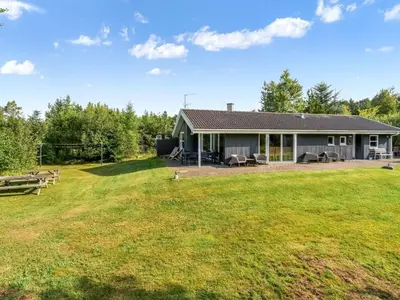 a house with a large yard in front of it at Holiday Home Ane - 800m from the sea by Interhome in Fjerritslev