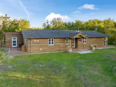 a log cabin with a large yard at Holiday Home Zölestine - from the sea by Interhome in Fjerritslev