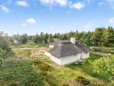 an overhead view of a white house in a field at Holiday Home Elenor - 1-1km from the sea by Interhome in Fjerritslev