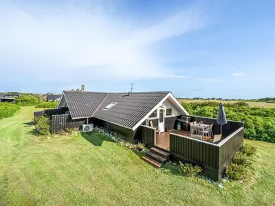 an aerial view of a house with a large yard at Holiday Home Angelie - 400m from the sea by Interhome in Harboør