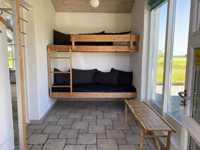 a room with bunk beds in a tiny house at Light-filled Retreat in Boddum - By Traum Ferienwohnungen in Boddum