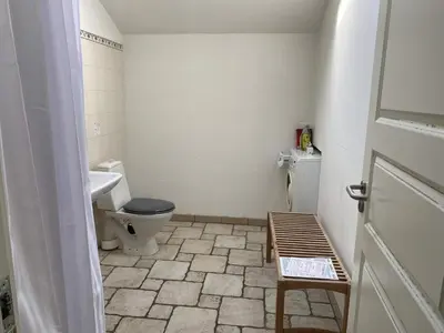 a bathroom with a toilet and a sink at Light-filled Retreat in Boddum - By Traum Ferienwohnungen in Boddum