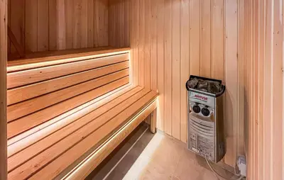 a corner of a sauna with a heat register in it at 2 Bedroom Stunning Home In Harboøre in Harboør