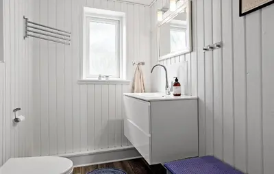 a white bathroom with a sink and a toilet at 4 Bedroom Lovely Home In Vestervig in Vestervig