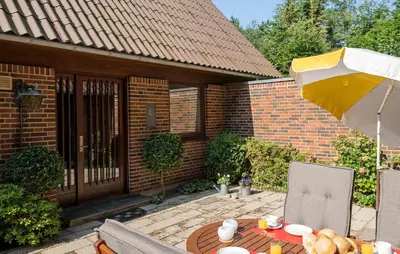 a patio with a table and an umbrella at Stunning Home In Højslev With Wifi in Højslev