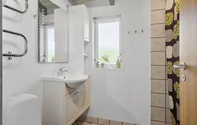 a white bathroom with a sink and a toilet at 3 Bedroom Beautiful Home In Vinderup in Vinderup