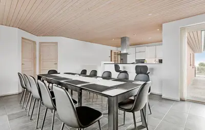 a dining room with a table and chairs at Amazing Home In Vesløs With Wifi in Øsløs
