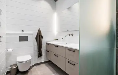 a bathroom with a toilet and a sink at 4 Bedroom Pet Friendly Home In Blokhus in Blokhus