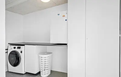 a laundry room with a washing machine and a counter at 4 Bedroom Nice Home In Harboøre in Harboør