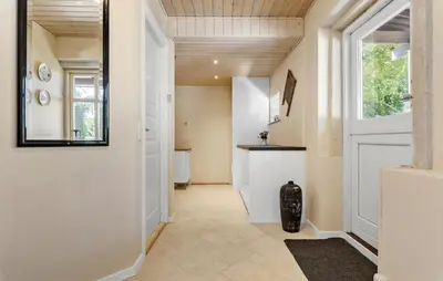 a hallway with a door leading to a kitchen at Stunning Home In Ranum With Wifi in Ranum