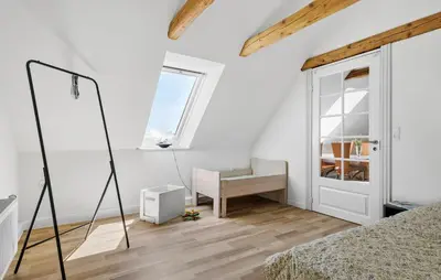 a white room with a bed and a desk at Stunning Home In Ranum With Wifi in Ranum