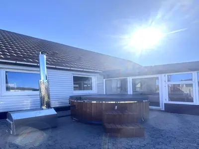 a house with a hot tub in the yard at Holiday Home Darja - 300m from the sea by Interhome in Thyborøn