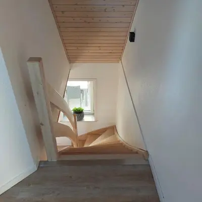 a staircase in a house with a window at Vakantiewoning Denemarken in Års