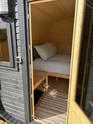 a small bed in a sauna in a house at Stone MT Garden Pod in Snedsted