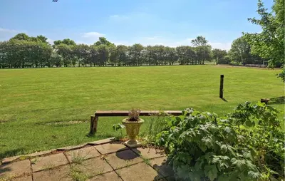 a field with a bench and a field with a field at 2 Bedroom Stunning Home In Erslev in Erslev