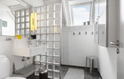 a bathroom with a sink and a toilet at 3 Bedroom Stunning Home In Vestervig in Vestervig