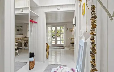 a hallway of a home with white walls at Beautiful Home In Blokhus in Blokhus