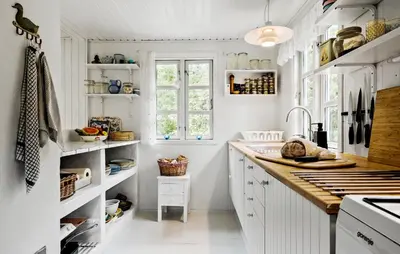 a kitchen with white cabinets and a counter top at Beautiful Home In Blokhus in Blokhus