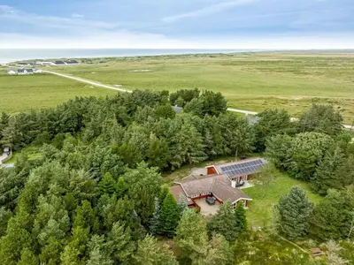 an overhead view of a house with a solar roof at Holiday Home Aisling - 700m from the sea by Interhome in Brovst