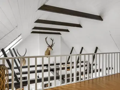 a room with two deer heads on the wall at Apartment Thorgot - 3km from the sea by Interhome in Pandrup