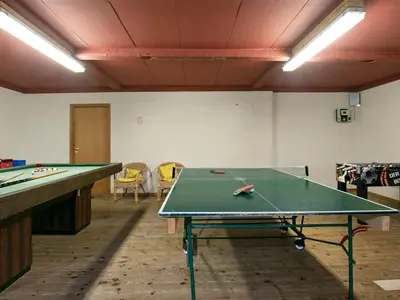 a ping pong table in a room with a ping pong table at 14 person holiday home in Løgstør-By Traum in Løgstør
