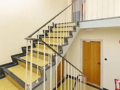 a staircase in a building with a wooden door at Rustic Retreat in Gettrup - By Traum Ferienwohnungen in Sindrup