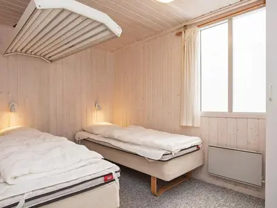 two twin beds in a room with a window at 8 person holiday home in Hurup Thy-By Traum in Sindrup