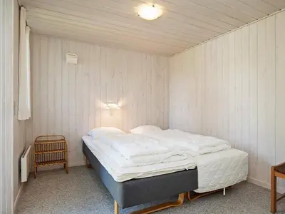 a bedroom with a large bed in a room at 8 person holiday home in Hurup Thy-By Traum in Sindrup