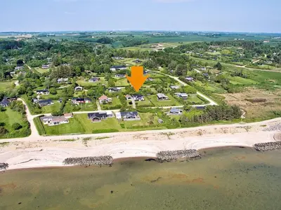 an aerial view of a home with a yellow arrow on it at 6 person holiday home in Spøttrup-By Traum in Lihme