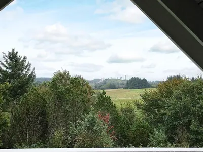 a view of a field and trees from a tent at 10 person holiday home in Fur-By Traum in Fur