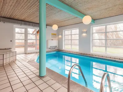 a swimming pool in a house with a pool at 10 person holiday home in Fur-By Traum in Fur