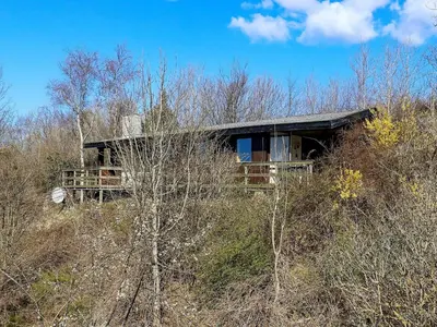 a small house on a hill in the woods at 6 person holiday home in Spøttrup-By Traum in Lihme