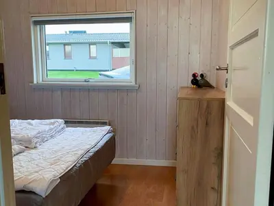 a bedroom with a bed and a window at 4 person holiday home in Lemvig-By Traum in Lemvig