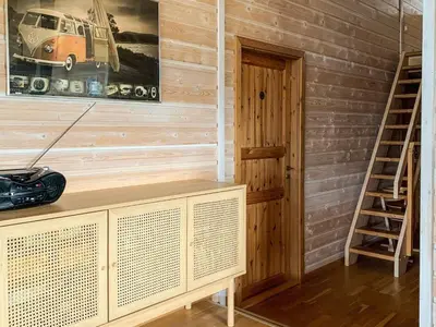 a room with a wooden wall with a car on the wall at 10 person holiday home in Thisted-By Traum in Klitmøller