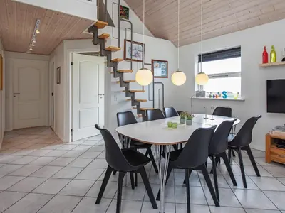 a dining room with a table and chairs at 8 person holiday home in Vestervig-By Traum in Vestervig