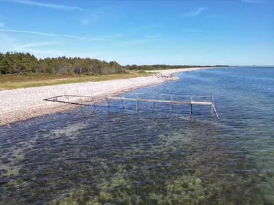 a dock in the middle of a body of water at 4 person holiday home in Hurup Thy-By Traum in Sindrup
