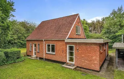 a small red brick house in a yard at Lovely Home In Vemb With House Sea View in Vemb