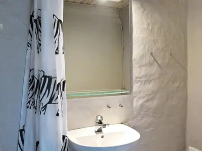 a bathroom with a sink and a mirror at 4 person holiday home in Lemvig-By Traum in Trans