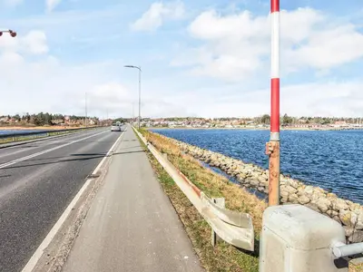 a road next to a body of water at 8 person holiday home in Højslev-By Traum in Bøstrup