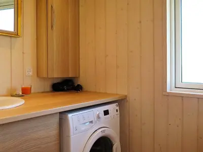 a washing machine in a kitchen with a counter at 6 person holiday home in Lemvig-By Traum in Trans