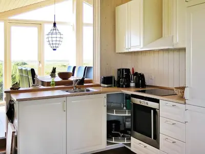 a kitchen with white cabinets and a sink at 6 person holiday home in Lemvig-By Traum in Trans