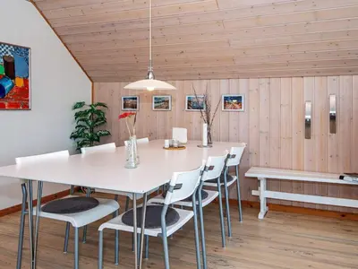 a dining room with a white table and chairs at 6 person holiday home in Harboøre-By Traum in Harboør