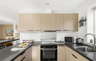 a kitchen with white cabinets and a sink at Beautiful Home In Thisted With Sauna in Thisted