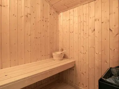 a wooden sauna with a bucket on a shelf at 6 person holiday home in Vinderup-By Traum in Vinderup