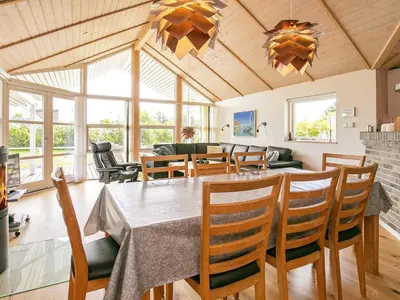 a dining room with a table and chairs at 8 person holiday home in Lemvig-By Traum in Lemvig
