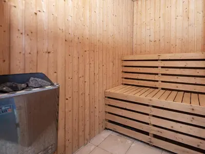 a room with a wooden wall with a wooden bench at 10 person holiday home in Løgstør-By Traum in Trend