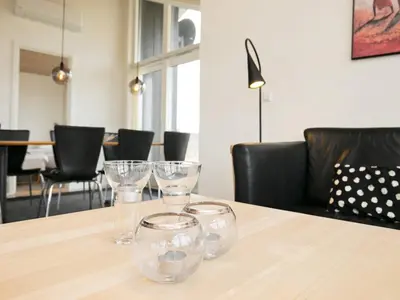a table with wine glasses sitting on top of it at 8 person holiday home in Brovst-By Traum in Brovst